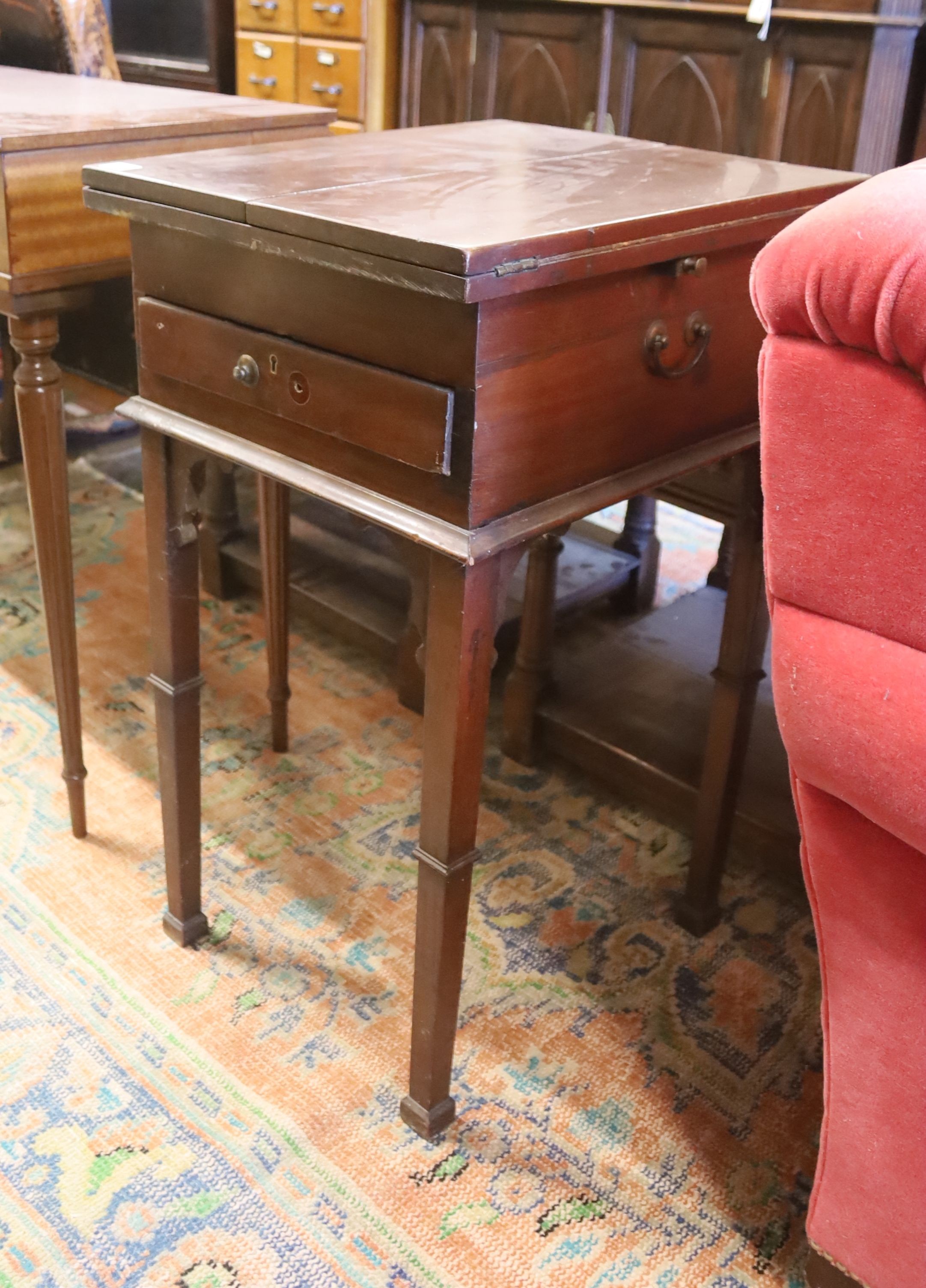 A Victorian mahogany writing/work table with twin hinged flap top, width 42cm, depth 50cm, height 77cm